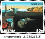 Small photo of Milan, Italy - January 24, 2022: The persistence of memory by Salvador Dali on african stamp