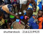 Small photo of A woman serving nutritional food to the people who attend the health and nutrition session at Chiunjila village in Newala district, Mtwara region, Tanzania on February 23, 2022