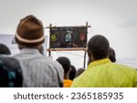 Small photo of People watching the CAF Confederetion final match between Yanga vs USM Alger in Peramiho, Ruvuma region on May 28, 2023