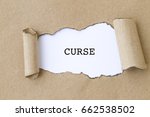 Small photo of CURSE word written under torn paper.