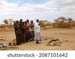 Small photo of Mogadishu, Somalia - September 28, 2011 - Relatives praying for their deceased relatives in Somalia hit by drought.