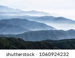 Layers Of Misty Ridges In The...
