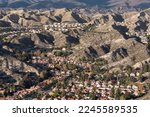 Aerial view of hillside housing tracts in suburban Santa Clarita near Los Angeles California.
