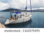 Small photo of Lefkada, Greece - September 20, 2017: Modern Boat to drop anchor in a harbour on the waterfront of Lefkada city. Lefkada or Lefkas is a Greek island in the Ionian Sea on the west coast of Greece