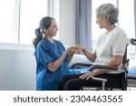Small photo of Asian senior care nurses and grandmothers provide caring support to elderly women hand clasp to encourage exercising with elder disabled person patient with caregiver in nursing care.