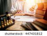 Small photo of Young man lawyer give suggestion mobile customer and reading the lawyer book for legislation issue to help afflicted people, front view photography with vintage picture style and sunlight effect.