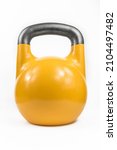 Small photo of Classic heavy cast iron kettlebell, painted yellow against a white studio background.