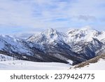 Small photo of Stunning view of Italian mountain range and valley from ski slope in Sauze D'Oulx ski resort, Turin, Italy. Beautiful Italian alpine peaks of snow capped mountains in the Piedmont region.