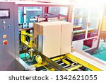 Small photo of Machine automatic molder of corrugated cardboard boxes