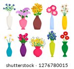 Set Of Colored Vases With...