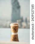 Small photo of Coffee mug with shadow on the 55th floor of a tall building