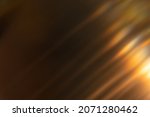 Blur light overlay. Lens flare rays. Defocused glare. Old film flash leak. Bokeh golden orange color beam design glow on dark black abstract background.