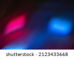 Small photo of Blur neon light. Lens flare overlay. Bokeh fluorescent flash gleam. Defocused blue magenta pink color flecks on dark black abstract background.