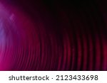 Small photo of Blur neon background. Curved texture. Lens flare. Glowing fluorescent tunnel. Defocused magenta pink color light reflection on dark bent lines pattern abstract overlay.