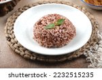 Small photo of Steamed Brown Rice or Nasi Merah. a whole grain rice with the inedible outer hull removed. Rice sheds its outer hull or husk but the bran and germ layers remain on,constituting the brown color of rice