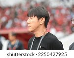 Small photo of Indonesia national football coach Shin Tae-yong in AFF Mitsubishi Electric Cup 2022 championship at Gelora Bung Karno main stadium. Jakarta, Indonesia. December 23 2022.