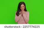 Small photo of Sneaky cunning woman with tricky face gesticulating and scheming evil plan, thinking over devious villain idea, cheats, revenge, jokes pranks. Young girl isolated on green screen chroma key background