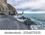 Small photo of Breathtaking view of rock formations Troll Toes on Black beach Reynisfjara near the village of Vik. Location: Reynisfjara Beach, Vik Village, Iceland (Sudurland), Europe