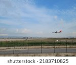 Small photo of BARCELONA, SPAIN - 23th of July 2022: Iberia airplane landing in Barcelona- El Prat Airport. Iberia is a spanish airline. Views from "El Delta del Llobregat"