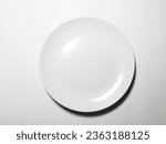 Small photo of diet background. empty plate isolated on white. greed spoon and fork. with text diet. for fat woman.