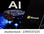Small photo of Microsoft logo on phone and blurred AI chip on the background, USA, November 15, 2023