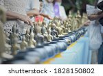 Small photo of Backside of small buddha statue on table for Buddhists to worship and exorcise bad luck according to religious beliefs. Selective focus.