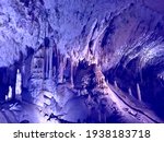 Small photo of Magic underground cave formations. Postojna Cave fascinating subterranean paradise. Cave boasts towering mountains, murmuring vast subterranean halls. Speleobiology dream. Awe stalagmites, stalactites