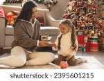 Pocket money. Mom gives the child cash on Christmas. Education, school and money saving concept. Junior Savings Account concept