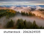 Small photo of the light of the setting sun illuminates a landscape immersed in fog and clouds, mountains and valleys with lingering mist, severne Slovensko, Horne Povazie, constantly changing