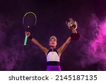 Tennis Player With Cup And...