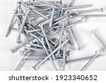 Chrome metal screw and on isolated white background, crosshead screw