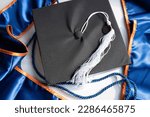 Small photo of 2023 Celebration Orange and Blue Cap and Gown Mortarboard Graduation Ceremony Regalia with Stole, White Tassel and Cord