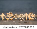 Religious symbols on sand....