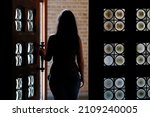 Woman  Opening A Door. Belgium. 