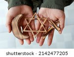 Christianity, Islam, Judaism  3  monotheistic religions. Jewish  Star, Cross and Crescent :  Interreligious symbols in hands.  Religious and faith concept.  06-30-2018
