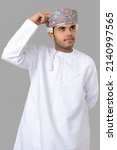 Small photo of Omani business man making hand gesture thinking