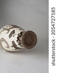 Small photo of An omniscient mythical asian beast painted pottery