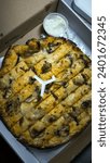 Small photo of Cheese stick pizza on a paper box with cheese tar tar and mayonnaise sauce