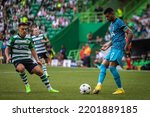 Small photo of Lisbon, Portugal - 09 13 2022: UEFA Champions League game between Sporting CP and Tottenham Hotspur F.C; Cristian Romero in a duel with Pedro Goncalves