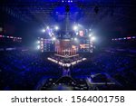 Small photo of MOSCOW, RUSSIA - 14th SEPTEMBER 2019: esports Counter-Strike: Global Offensive event. Big illuminated main stage of a computer games tournament located on a big stadium. Tribunes are full of video