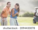 Women laughing on golf course