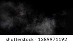 smoke blow isolated on dark... | Shutterstock . vector #1389971192