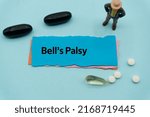 Small photo of Bell's Palsy.The word is written on a slip of colored paper. health terms, health care words, medical terminology. wellness Buzzwords. disease acronyms.