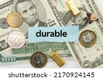 durable.The word is written on a slip of paper,on colored background. professional terms of finance, business words, economic phrases. concept of economy.