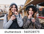 Small photo of Portrait funny joyful attractive young women with drinks having fun on sunny street in city, smiling, lovely moments, best friends, expressing true positive emotions
