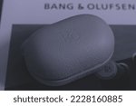 Small photo of Shanghai, China- November 8,2022: Close-up of the case of Bang and Olufsen E8 3RD Bluetooth earphones