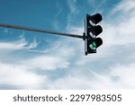 hanging traffic light against the sky 