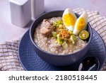 Small photo of Arroz caldo, is a Filipino rice and chicken gruel heavily infused with ginger and garnished with toasted garlic, scallions, and black pepper. It is usually served with calamansi or fish sauce (patis)