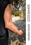 Small photo of man showing big and dashing muscles outdoor. muscular and sinewy hand.