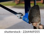 Small photo of Blue corroded anode on the propeller shaft of a sailing yacht in winter storage. Metal ships are protected with a so-called sacrificial base metal anod, which will corrode instead of the metal itself.